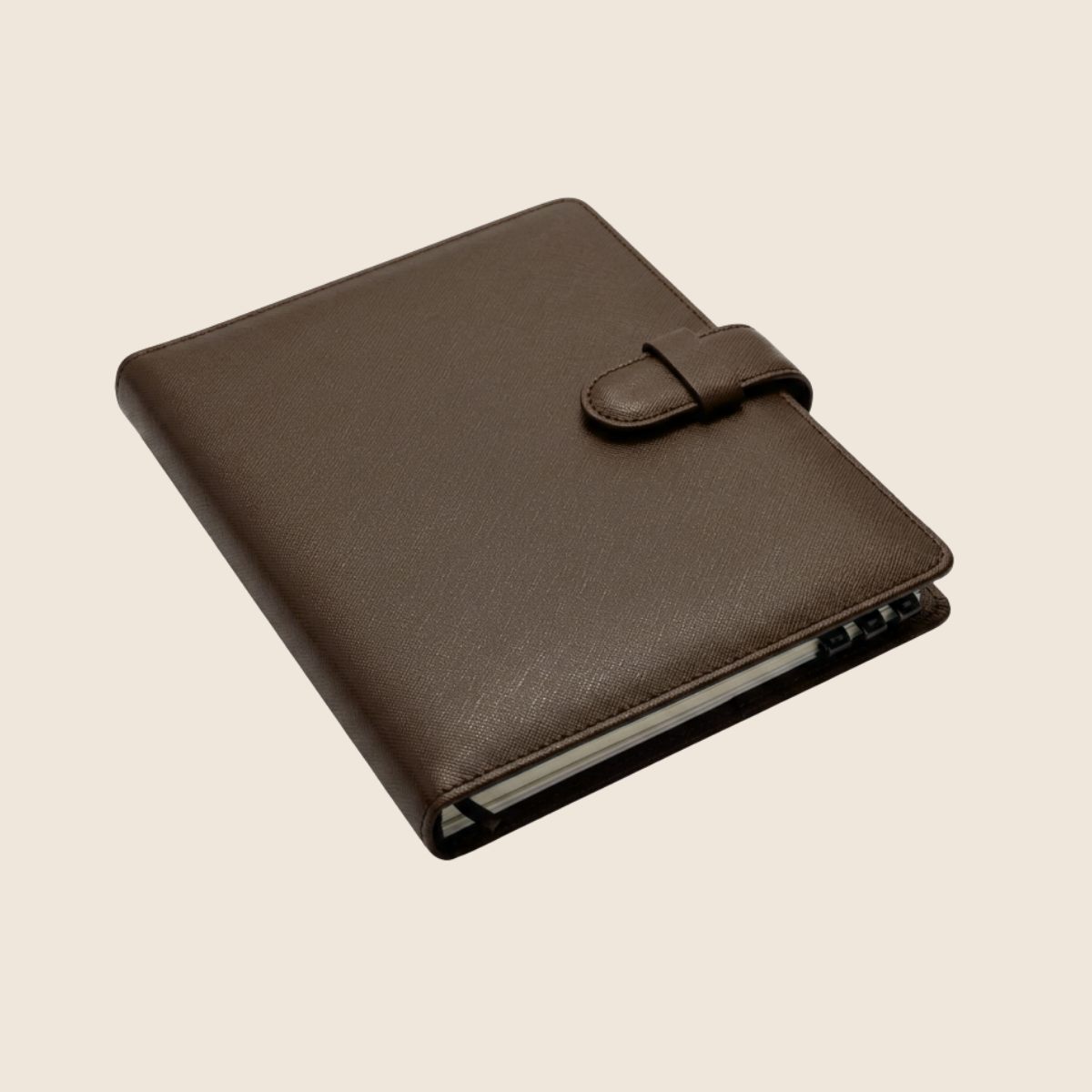 The Signature Leather Planner in Espresso, closed, three-quarter view